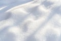 White fresh snow texture with shadows in sunny day. Beautiful winter background Royalty Free Stock Photo