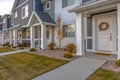 White front door of colorful townhomes with wreath Royalty Free Stock Photo