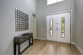 White front door opens to a contemporary foyer Royalty Free Stock Photo