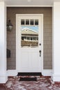 White front door with red and white brick porch Royalty Free Stock Photo