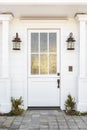 White front door to classic home