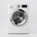 White front loading washing machine with digital display and chrome accents front loader Royalty Free Stock Photo