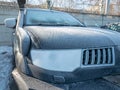 White frost on the car body. Small layer of snow