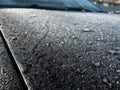 White frost on the car body. Small layer of snow