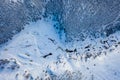 White frozen forest and river in winter. Aerial view of nature in Ural, Russia