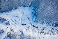 White frozen forest and river in winter. Aerial view of nature in Ural, Russia