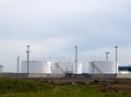 White fuel tanks in a field