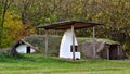 White furnace in front of rustic earth sheltered house