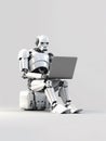 Android robot working on laptop Royalty Free Stock Photo