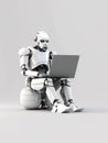 Android robot working on laptop Royalty Free Stock Photo