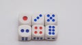 White game cubics with blue and red spikes dots on a white background. Royalty Free Stock Photo