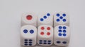 White game cubics with blue and red spikes dots on a white background. Royalty Free Stock Photo