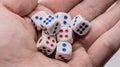 White game cubics in hand. Concept of luck, chance and leisure fun. Royalty Free Stock Photo