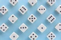 White gaming dices on light blue background. victory chance, lucky. Flat lay, place for text. Top view. Close-up. Concept gamble.