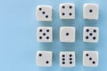 White gaming dices on light blue background. victory chance and lucky. Flat lay style, place for text. Top view and Close-up cube