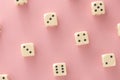 White gaming dices on pink background. victory chance and lucky. Flat lay style, place for text. Top view and Close-up cube.