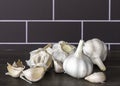 White garlic bulbs (Allium sativum) on wooden table. Royalty Free Stock Photo