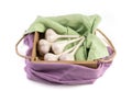 White garlic isolated on a white background, side view, beautifully packaged in a wooden box with colored napkins.