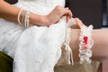 White garter, dressed on the Bride's leg. Royalty Free Stock Photo