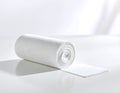 Absorbent white gauze roll for medical care in clean minimalist setting is perfect for product mockups Royalty Free Stock Photo