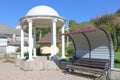 A white gazebo near a small spring. Places to relax.