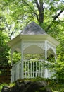 A white gazebo surrounded by green trees near Blue Spring Heritage Center, Eureka Springs, Arkansas, U.S