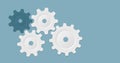 White gears and cogs on blue, cooperation concept background Royalty Free Stock Photo