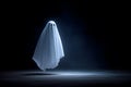 A white ghost silhouette floating with a dark isolated background Royalty Free Stock Photo