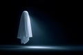 A white ghost silhouette floating with a dark isolated background Royalty Free Stock Photo