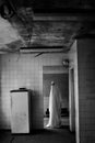 White ghostly figure in abandoned room, haunted house interior, atmosphere with old things. Halloween concept. Copy