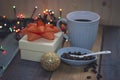 White gift box, blue cup, coffee beans in a bowl, golden ballnn Royalty Free Stock Photo