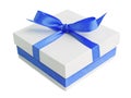 White gift box with blue satin ribbon bow Royalty Free Stock Photo