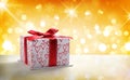 White gift box with bow and hearts Golden bokeh front Royalty Free Stock Photo