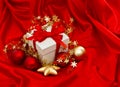 White gift box with christmas decoration. Red gold baubles stars Royalty Free Stock Photo