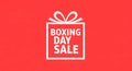 Boxing Day Sale Gift Box on Red Background Royalty Free Stock Photo