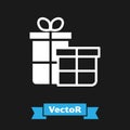 White Gift box icon isolated on black background. Merry Christmas and Happy New Year. Vector Royalty Free Stock Photo