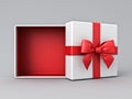 White gift box open with blank red bottom box or top view of present box tied with red ribbon and bow on grey white Royalty Free Stock Photo