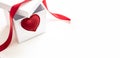 White gift box open, red heart and satin ribbon on white, space. Valentine day present Royalty Free Stock Photo