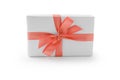 White gift box with orange ribbon bow isolated on white background Royalty Free Stock Photo