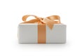 White gift box with orange ribbon bow isolated on white background Royalty Free Stock Photo