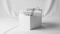 A white gift box with a partially removed lid revealing white tissue paper inside. The lid features Royalty Free Stock Photo