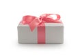 White gift box with pink ribbon bow isolated on white background Royalty Free Stock Photo