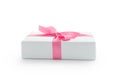 White gift box with pink ribbon bow isolated on white background Royalty Free Stock Photo