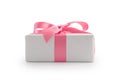 White gift box with pink ribbon bow isolated on white background Royalty Free Stock Photo