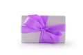 White gift box with purple ribbon bow isolated on white background Royalty Free Stock Photo