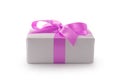 White gift box with purple ribbon bow isolated on white background Royalty Free Stock Photo