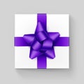 White Gift Box with Purple Violet Ribbon Bow Royalty Free Stock Photo