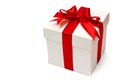 White gift box with a red ribbon and bow