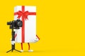White Gift Box and Red Ribbon Character Mascot with DSLR or Video Camera Gimbal Stabilization Tripod System. 3d Rendering Royalty Free Stock Photo