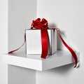 White gift box with a red satin ribbon Royalty Free Stock Photo